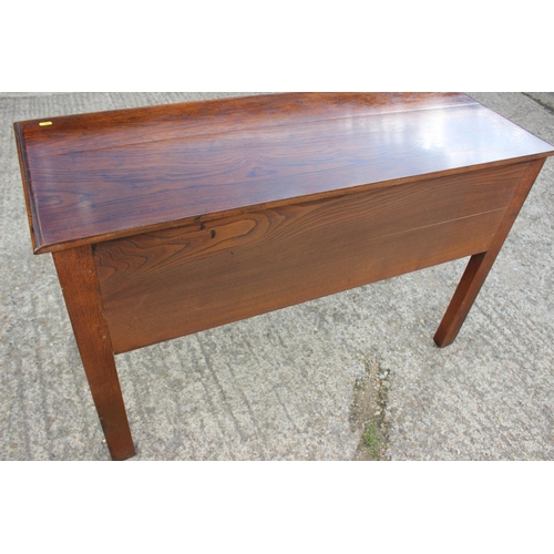 542 - An oak sideboard/carving table, fitted three drawers, on shaped supports, 48