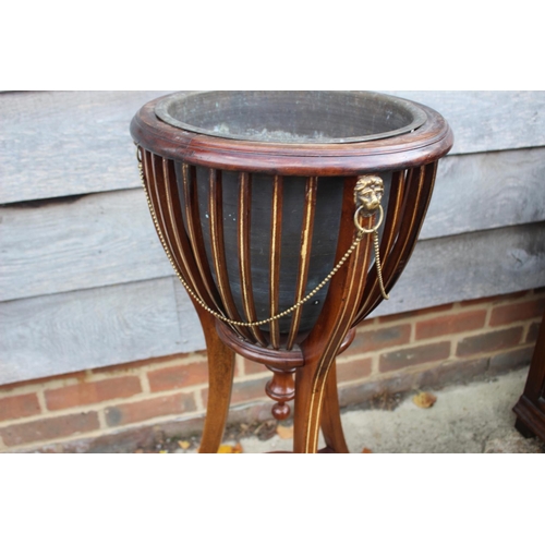 546 - An Edwardian mahogany and box line inlaid jardiniere stand with lion masks and brass swags and line,... 