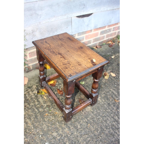 551 - An oak joint stool of 17th century design, on turned and stretchered supports, 18