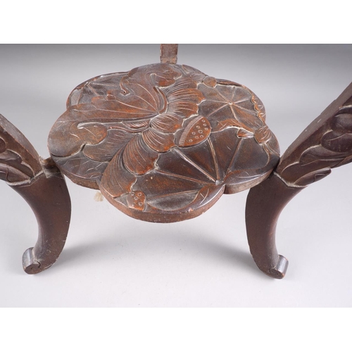 553 - A Japanese carved shaped top two-tier occasional table, on carved cabriole supports, 21