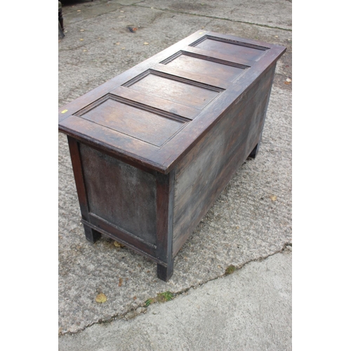 557 - An oak panel front coffer of 17th century design with split turnings, on stile supports, 48