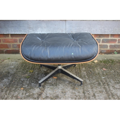 559 - A 1960s Herman Miller black leather seat stool, on quadruple splay supports