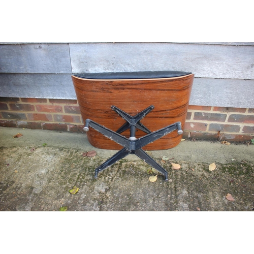 559 - A 1960s Herman Miller black leather seat stool, on quadruple splay supports