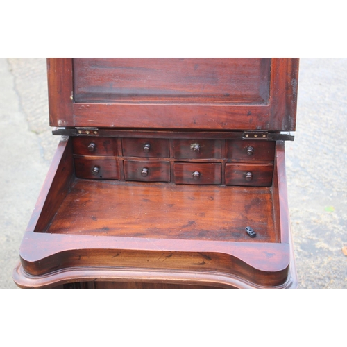 577 - A mahogany Davenport desk, fitted tooled lined top and  stationery compartment, over four drawers, 2... 