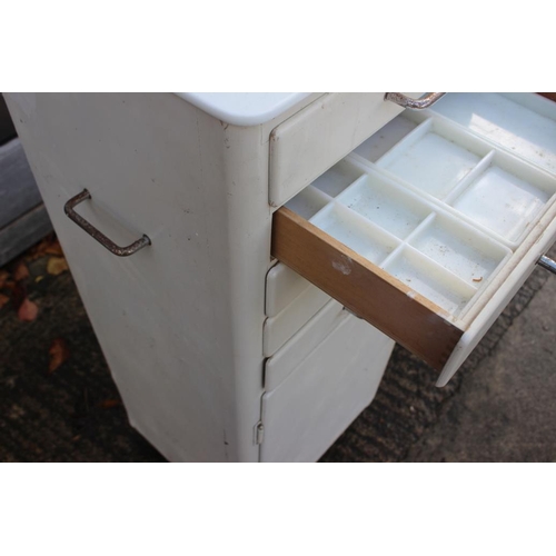 579 - A dentist's instrument cabinet, fitted five drawers with glass liners over cupboard, 15 1/2