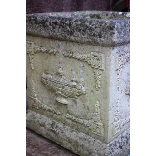 600 - A cast stone planter with vase and swag decoration, 15