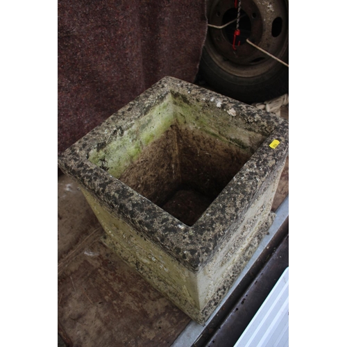 600 - A cast stone planter with vase and swag decoration, 15