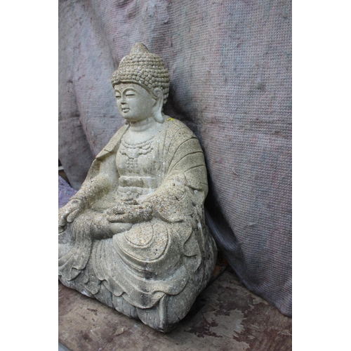 602 - A cast stone seated Buddha, on lotus, 24