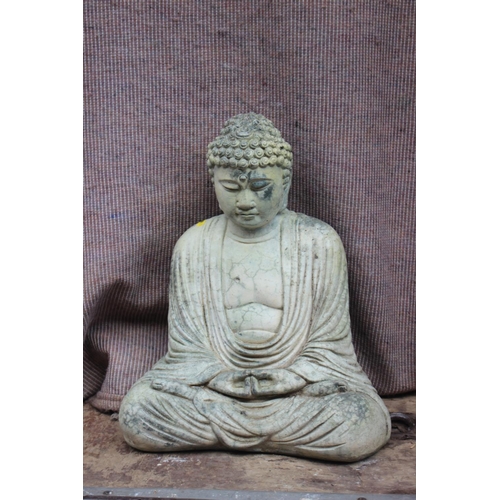 603 - A cast stone seated Buddha, on plinth, 21