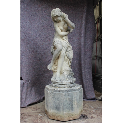 605 - A cast stone figure of a girl, on square stand, 42