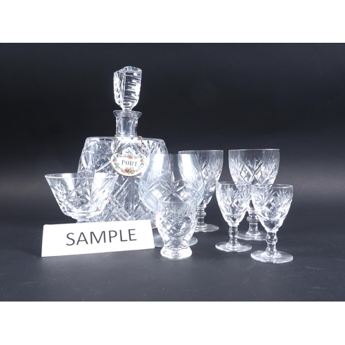 73 - A quantity of cut glass tableware, including wines, brandies, three decanters, a jug and other items