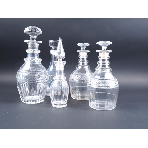 78 - A pair of Georgian triple ring necked decanters and stoppers, and three other decanters