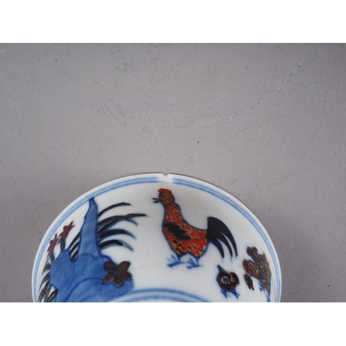 87 - A Chinese porcelain polychrome chicken decorated bowl, 3 1/4