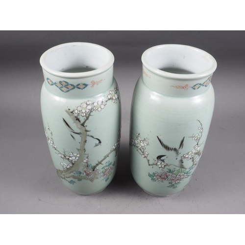 88 - A pair of Chinese celadon glazed and bird decorated cylinder vases, 12 1/4