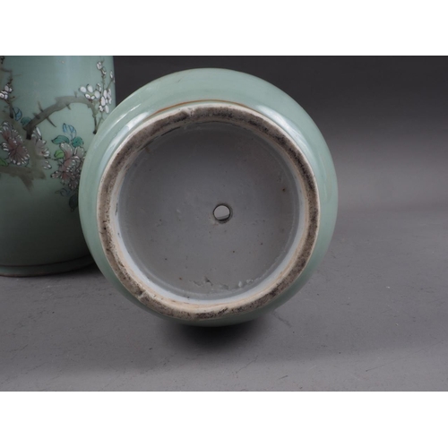 88 - A pair of Chinese celadon glazed and bird decorated cylinder vases, 12 1/4