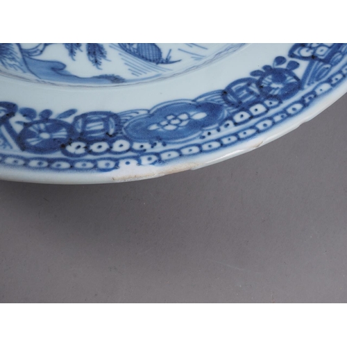 93 - A Chinese blue and white plate with central landscape decoration and floral borders, 9