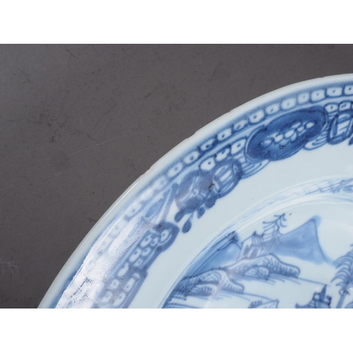 93 - A Chinese blue and white plate with central landscape decoration and floral borders, 9