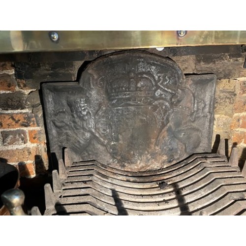 608 - A cast iron fireback with royal coat of arms, dated 1635, 24