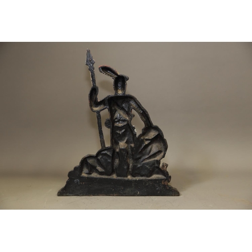 138 - A 19th century cast iron door stop, formed as a Highlander holding a spear, on serpentine base, 15