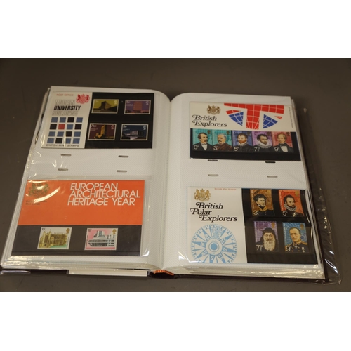 243 - An album of GB mint first day covers and presentation packs