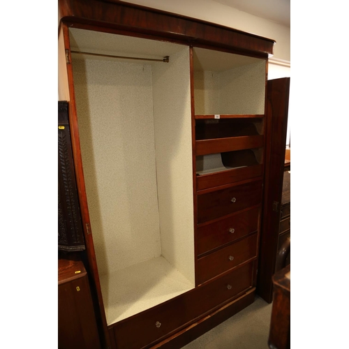 426 - A 19th century mahogany wardrobe, the interior fitted slides, drawers and hanging space, enclosed tw... 