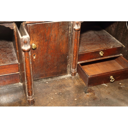 476 - A late 18th century oak bureau with fitted interior, over one long drawer, two short drawers and two... 