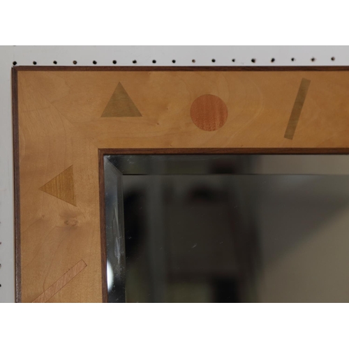 496 - A rectangular sycamore framed wall mirror with inlaid geometric shape design and bevelled plate, 29 ... 