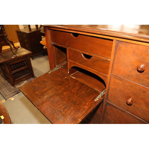 510 - A bachelor's mahogany chest, comprising drop down writing flap, drawers, faux drawers and wardrobe t... 