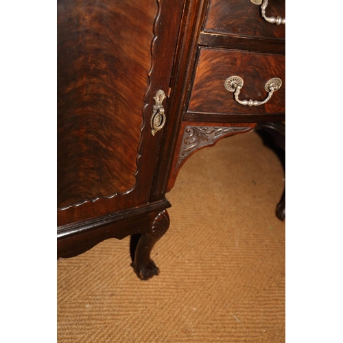 572 - An early 20th century carved mahogany break bowfront sideboard with anodised gallery over two drawer... 