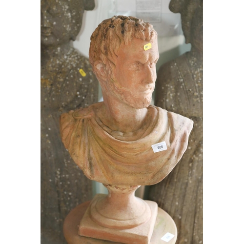 606 - A terracotta portrait bust of the Emperor Septimus Severus, on cylindrical stand, 44