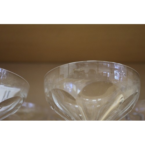 13 - Seven French? Art Deco faceted glass champagne coupes, on hexagonal bases, 5 1/2