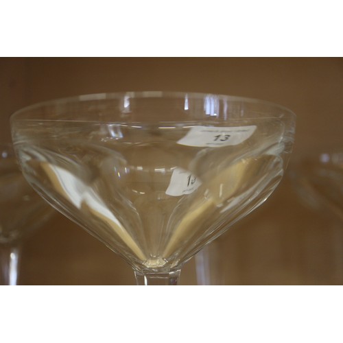 13 - Seven French? Art Deco faceted glass champagne coupes, on hexagonal bases, 5 1/2