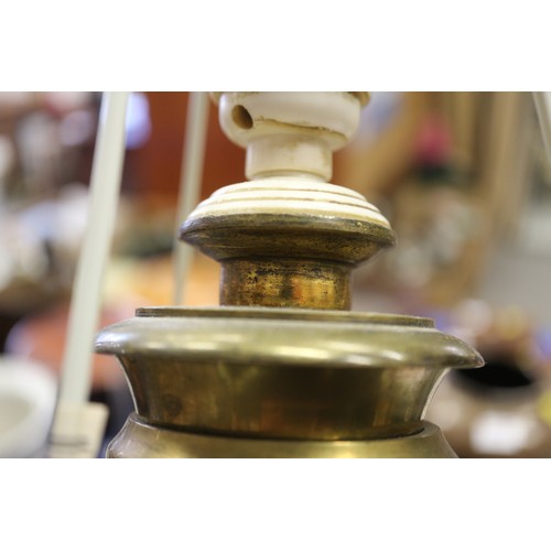 238 - A 19th century faceted white glass table lamp with brass circular base, 24