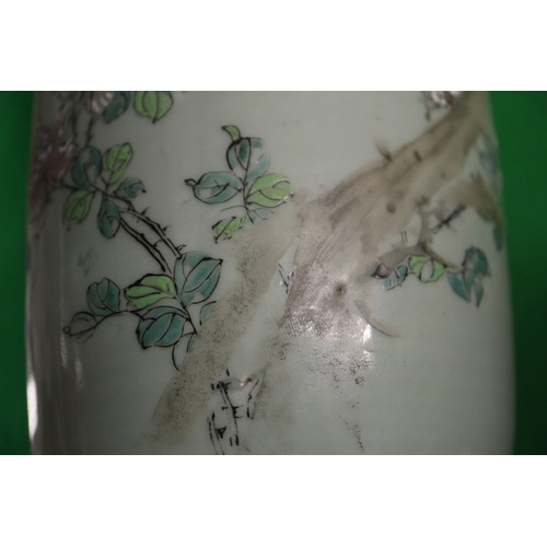 88 - A pair of Chinese celadon glazed and bird decorated cylinder vases, 12 1/4