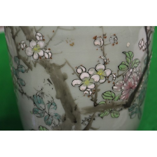 88 - A pair of Chinese celadon glazed and bird decorated cylinder vases, 12 1/4