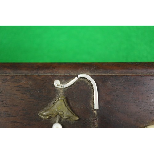 103 - A Japanese hardwood four section box with inset mother-of-pearl and wooden figure decoration. 6 1/2