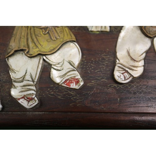 103 - A Japanese hardwood four section box with inset mother-of-pearl and wooden figure decoration. 6 1/2