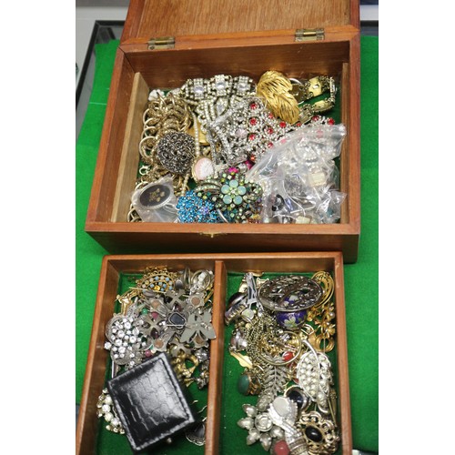 303 - A quantity of costume jewellery, including beaded necklaces, bangles, pendants, etc