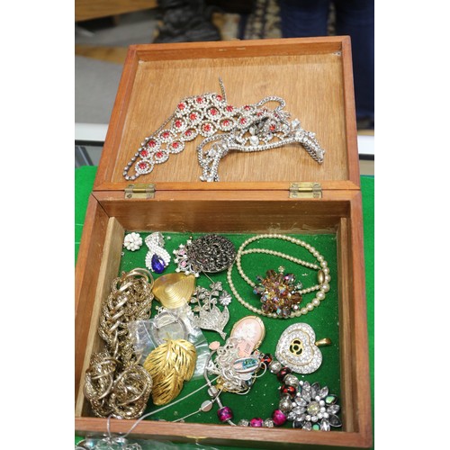 303 - A quantity of costume jewellery, including beaded necklaces, bangles, pendants, etc