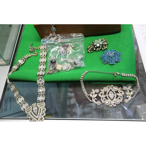 303 - A quantity of costume jewellery, including beaded necklaces, bangles, pendants, etc