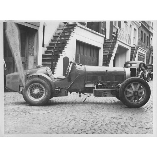 110 - Bugatti Photographs. Seven photographs of a competition Bugatti in a London mews, identified as bein... 