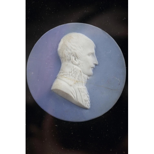 251 - A 19th century bisque porcelain cameo portrait of Napoleon, 2 1/8