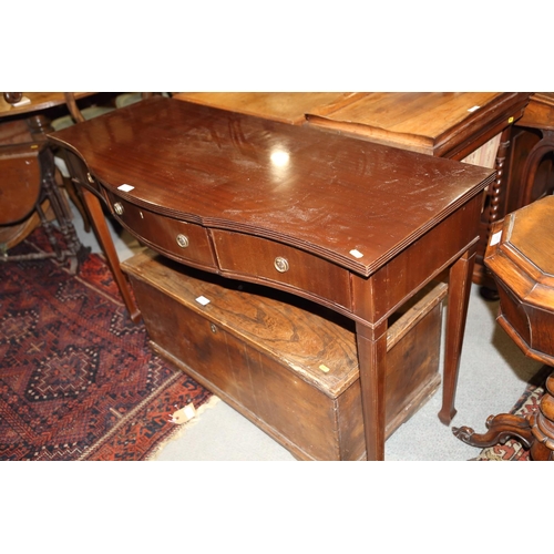 719 - A mahogany serpentine front side table, fitted three drawers, on square taper supports and spade fee... 