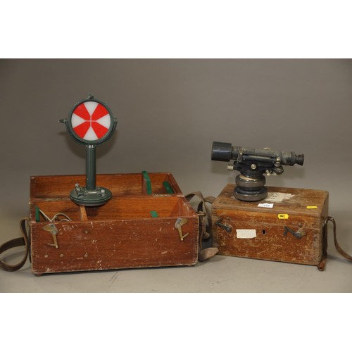 163 - A vintage theodolite, by Cooke, Troughton & Simms, in wooden travel case, and a surveyor's level... 