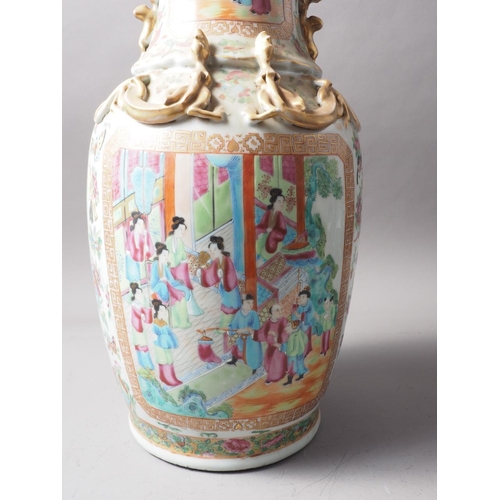 111 - A Chinese Canton vase with relief lizards, decorated panels with figures, precious objects, flowers ... 