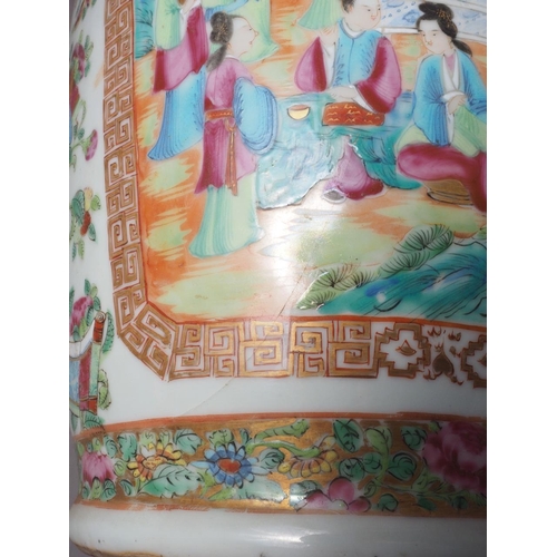 111 - A Chinese Canton vase with relief lizards, decorated panels with figures, precious objects, flowers ... 