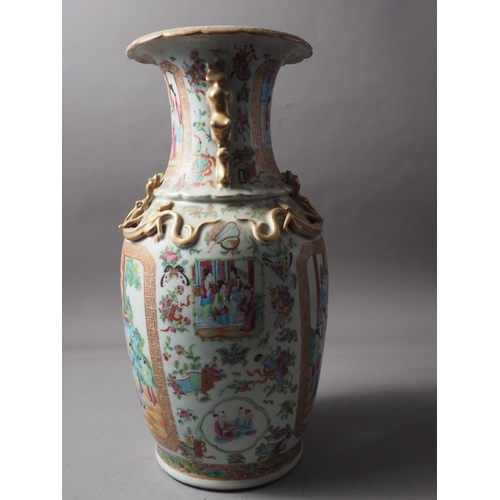 111 - A Chinese Canton vase with relief lizards, decorated panels with figures, precious objects, flowers ... 