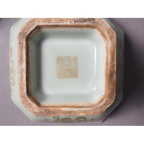 114 - A Chinese celadon glazed octagonal bowl with gilt decoration and gilt seal mark to base, on hardwood... 