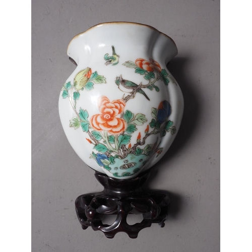 116 - A Chinese famille vert wall pocket with flower and bird decoration, and hardwood stand, 5 3/4