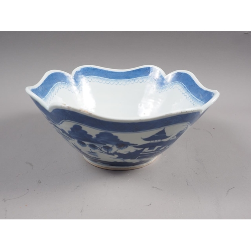 121 - A Chinese blue and white shaped rim bowl with panelled landscape decoration, 9 1/2